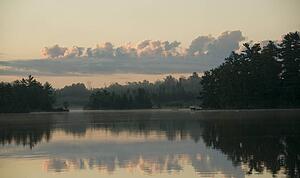 Lake of the Woods, Ontario, Canada; View across lake at sunrise