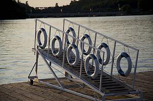 Kenora, Lake of the Woods, Ontario, Canada; Life preservers hanging on a dockside gangway