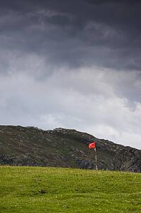 Islay, Scotland; Flag on a golf course