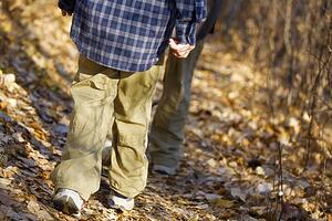 Low section of boy hiking