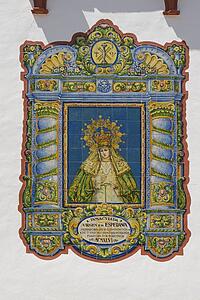 La Rambla, Córdoba, Andalucia, Spain; Decorative ceramic tiles depicting the Virgen de la Esperanza on church wall