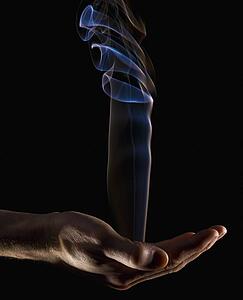 Smoke rising from a hand