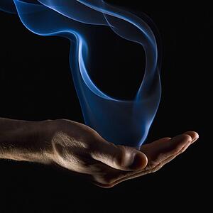 Smoke wisps from a hand