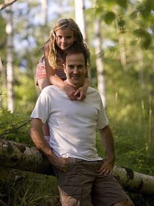 Daughter embracing father, Lake of the Woods, Ontario, Canada