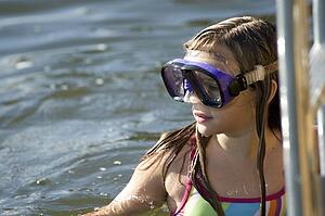 Teenage girl with swim goggles, Lake of the Woods, Ontario, Canada