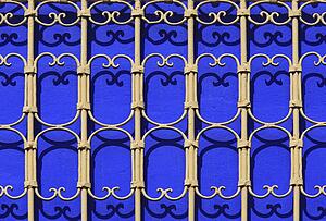 Iron railings against blue walls, Majorelle Gardens, Marrakech, Morocco 