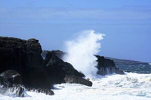 The Burren, Co Clare, Ireland; Waves breaking against rocks