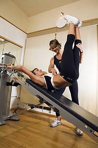 Young woman with personal trainer
