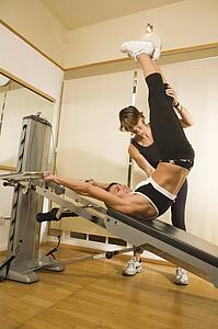 Young woman with personal trainer