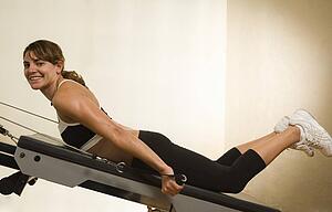 Young woman exercising in the gym