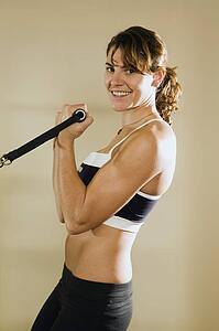 Young woman training in gym 