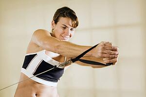 Young woman training in gym 