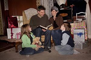 Family reading a story at Christmas time