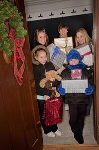 Kids delivering Christmas gifts