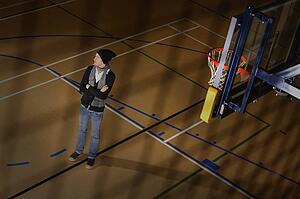 Man standing in basketball court