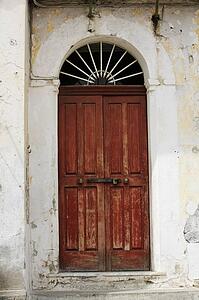 Ravello, Italy; weathered wall and wooden door