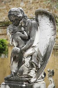 Florence, Italy; Statue of angel holding baby