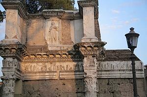 Rome, Italy; Roman ruins with modern statue