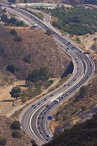 Highway near Malaga, Andalusia, Spain; Highway winding through landscape