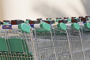 Shopping carts; Rows of shopping trolleys outside supermarket