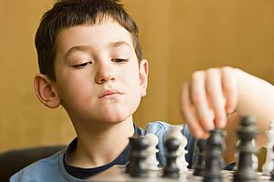 Boy playing chess