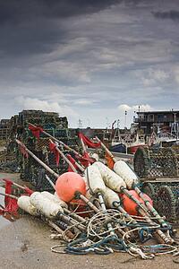 East Riding, Yorkshire, England; Fishing floats and lobster pots on the foreshore