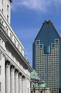 Montreal, Quebec, Canada; Architectural detail of Sunlife building and Basilique Marie-Reine-Du- Monde Cathedrale