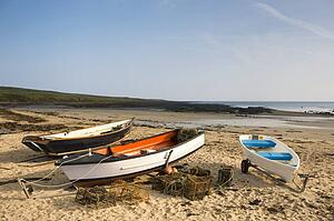 Empty boats on beach, Northumberland, England