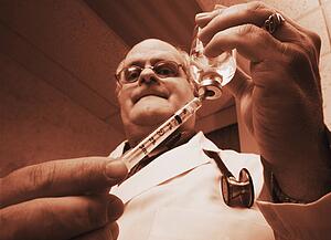 Doctor drawing injection