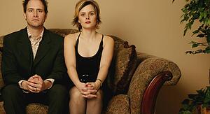 Couple sitting side by side