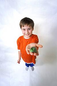 Child with a green frog