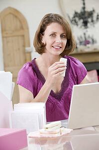 Woman eating lunch at her desk