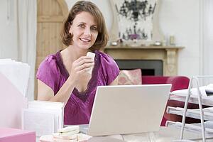 Woman eating lunch at her desk