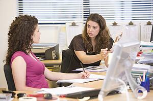 Women having an argument at work