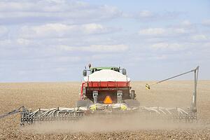 Tractor Planting Seed In Field