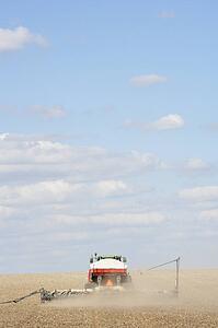 Tractor Planting Seed In Field