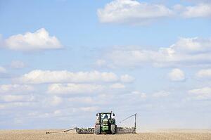 Tractor Planting Seed In Field