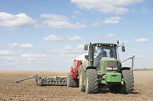 Tractor Planting Seed In Field