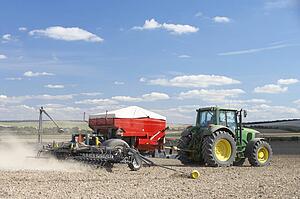 Tractor Planting Seed In Field