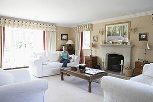 Woman Relaxing In Lounge