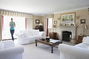 Woman Walking Through Lounge