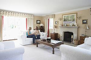 Two Women Relaxing In Lounge