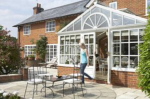 Exterior Of House With Conservatory And Patio