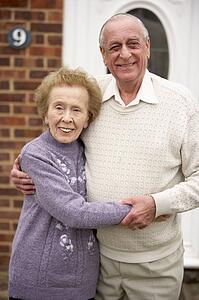 Senior Couple Outside Home