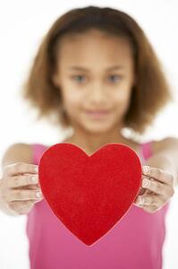 Young Girl Holding Heart