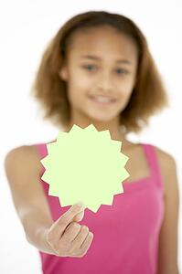 Young Girl Holding Sale Tag