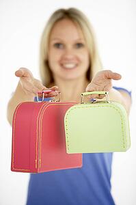 Woman Holding Two Suitcases