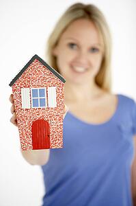 Woman Holding Model House