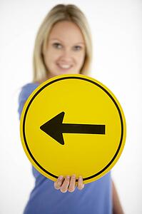 Woman Holding Road Traffic Sign