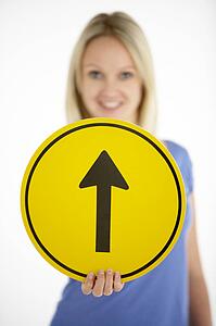 Woman Holding Road Traffic Sign